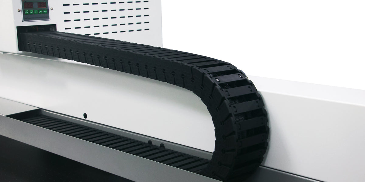 Compact industrial UV flatbed printer used for controlled short-run component production