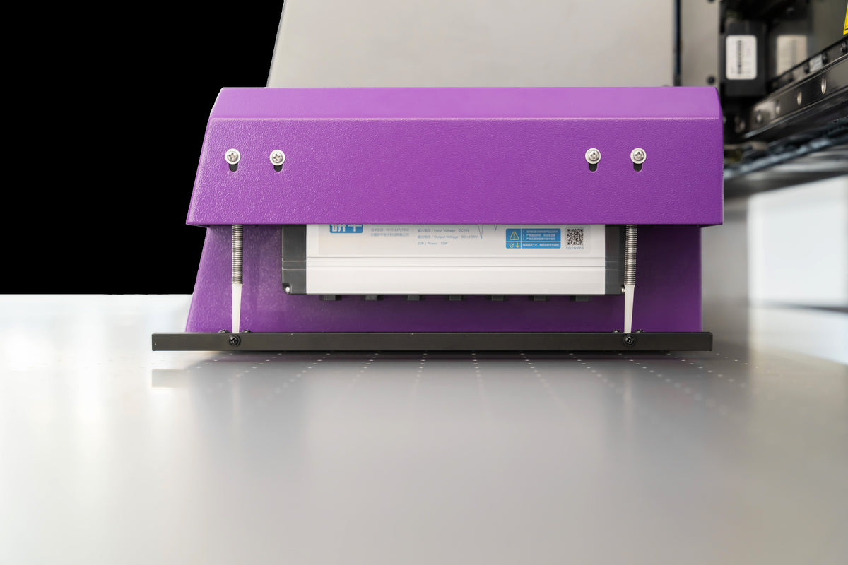 External ionizer bar fitted to an Andresjet UV flatbed printer for static control